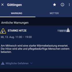 Hitzewarnung Bildschirmfoto der DWD-Warnapp vom 12-8-25 mit einer Hitzewarnung der Stufe 1 für Mittwoch 13-8-25 in der Zeit von 11-19 Uhr